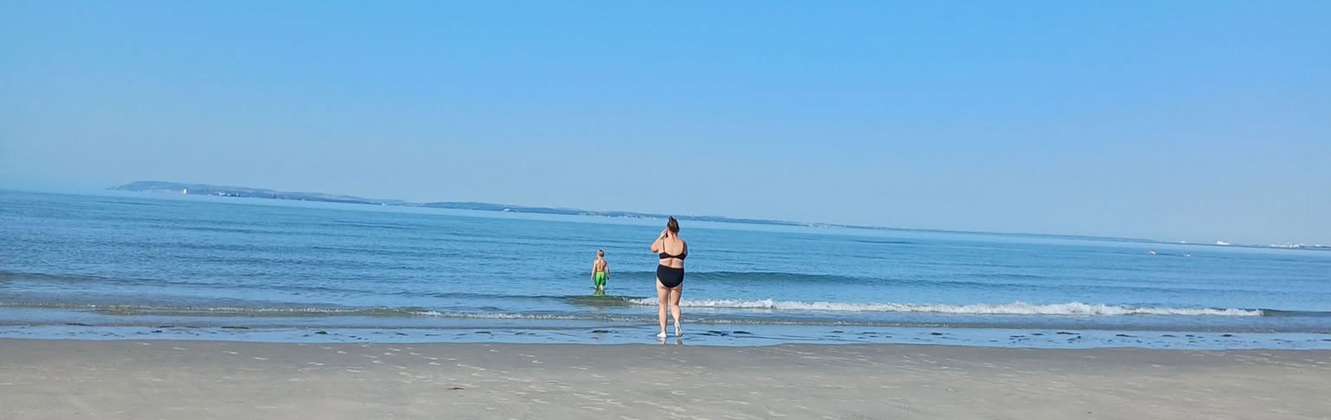 Mother and child on sandy West Witterings beach