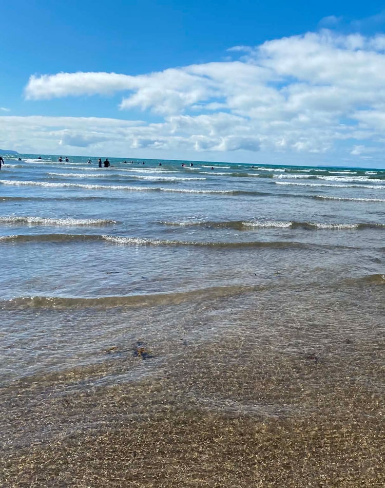 People in the sea on the coast of Northern Ireland